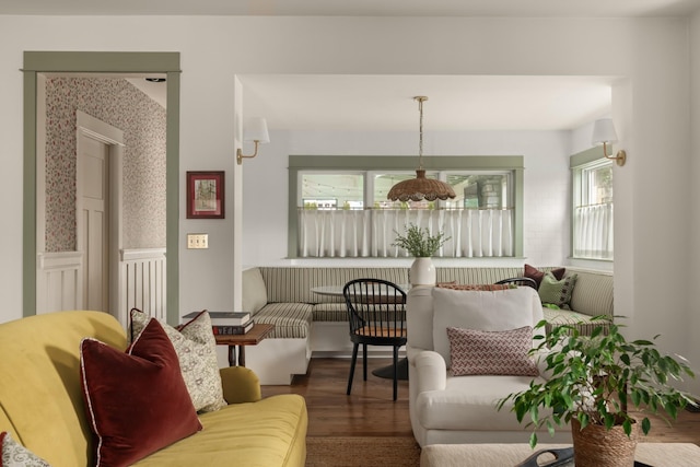 living room with breakfast area and wood-type flooring