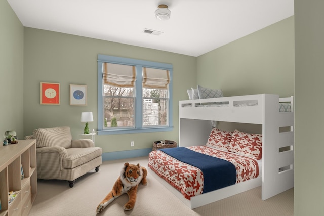 bedroom with light colored carpet