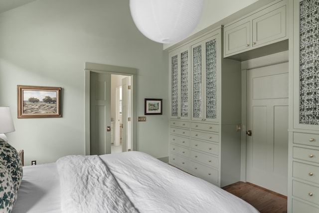 bedroom featuring dark wood-type flooring