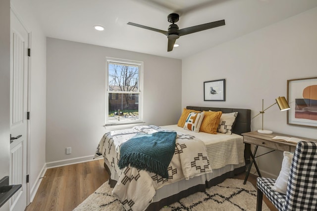 bedroom with hardwood / wood-style flooring and ceiling fan