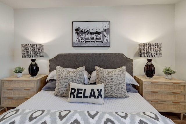 bedroom with dark wood-type flooring