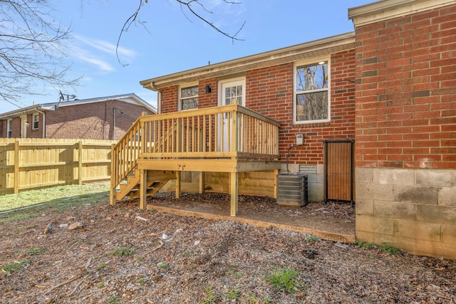 rear view of property featuring a deck