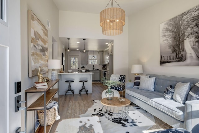 living room featuring dark hardwood / wood-style floors and a chandelier