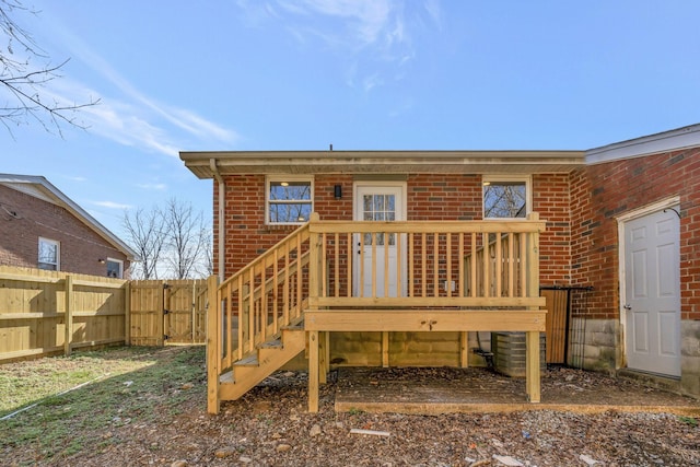 back of property featuring a deck