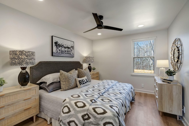 bedroom with hardwood / wood-style flooring and ceiling fan