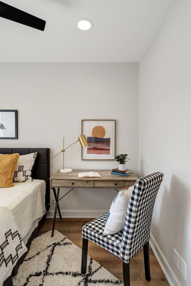 bedroom with hardwood / wood-style floors