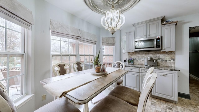 dining space featuring an inviting chandelier