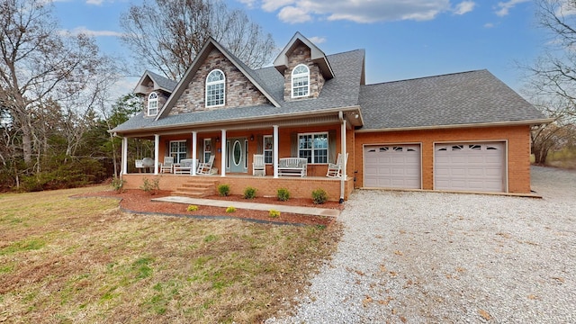 view of front facade featuring a garage and covered porch