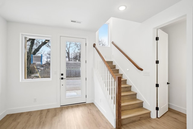 foyer entrance with light wood-type flooring