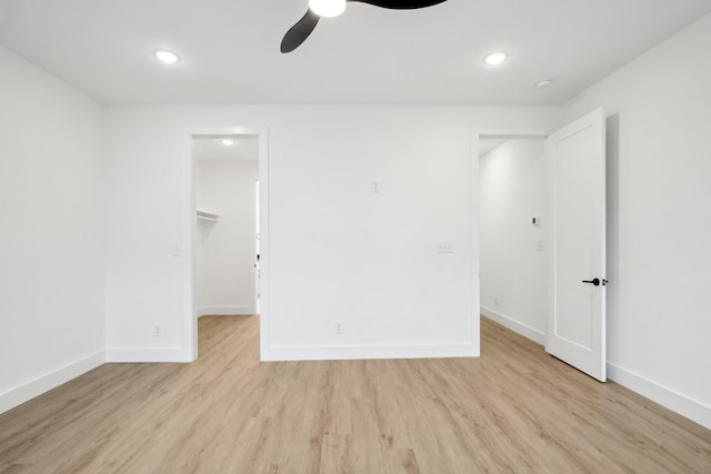 spare room with ceiling fan and light hardwood / wood-style floors