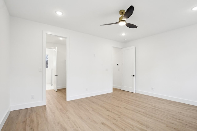 empty room featuring light hardwood / wood-style floors and ceiling fan