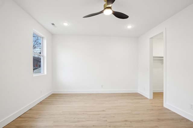 unfurnished room featuring ceiling fan and light hardwood / wood-style floors