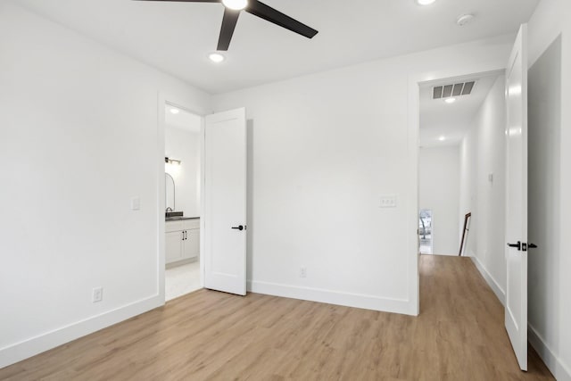 unfurnished bedroom with ceiling fan and light hardwood / wood-style flooring