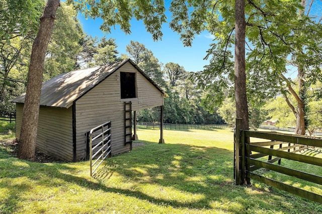 view of outbuilding featuring a lawn