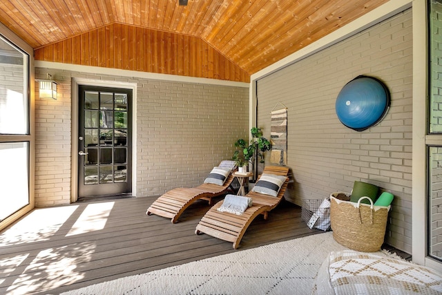 sunroom featuring wood ceiling and vaulted ceiling