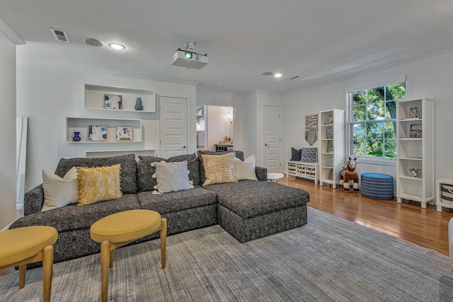 living room featuring hardwood / wood-style floors and ornamental molding