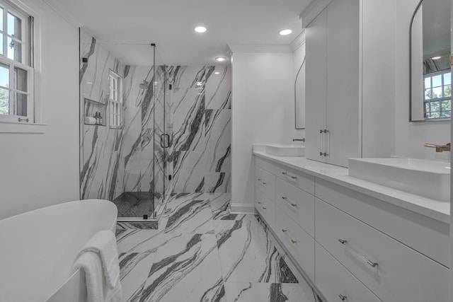 bathroom with vanity, crown molding, and a shower with door