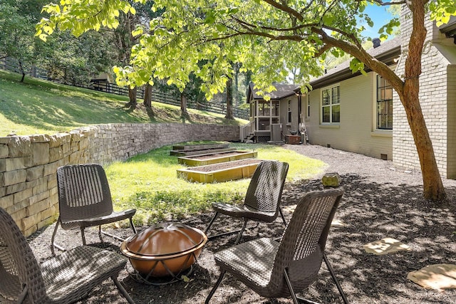 view of yard with a fire pit