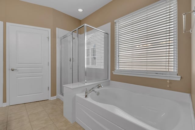 bathroom featuring independent shower and bath and tile patterned floors