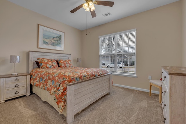 bedroom featuring ceiling fan and light carpet