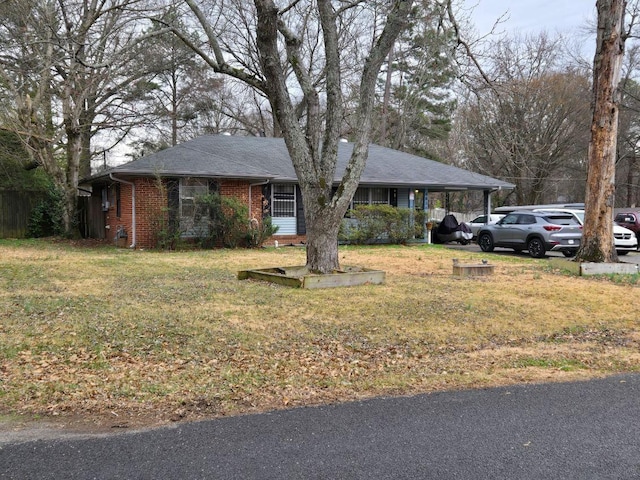 single story home with a carport and a front yard