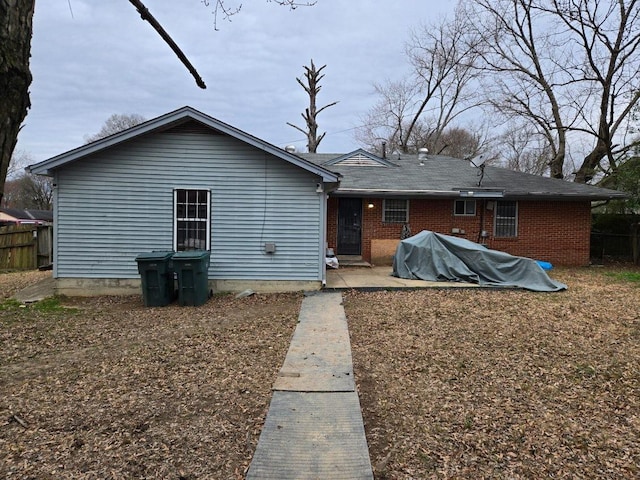 rear view of property featuring a patio area