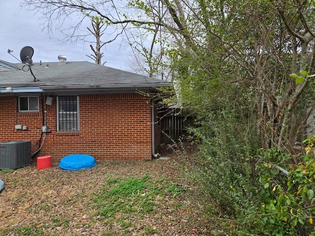 view of property exterior featuring central AC