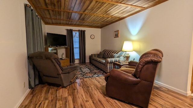 living room featuring wood ceiling and light hardwood / wood-style flooring