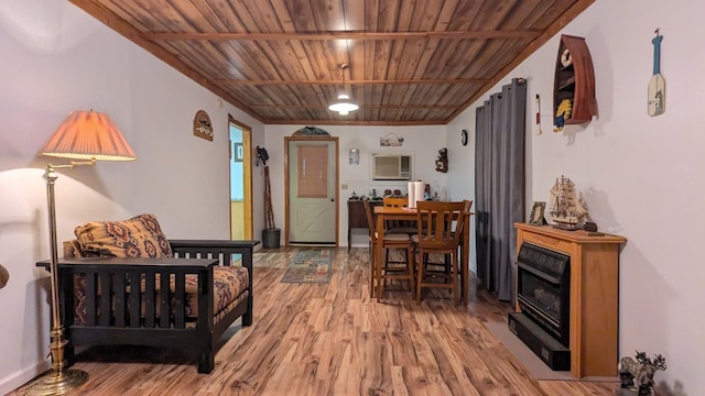 interior space with hardwood / wood-style floors and wooden ceiling