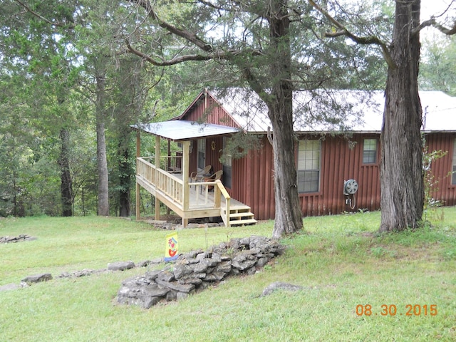 view of side of home featuring a yard