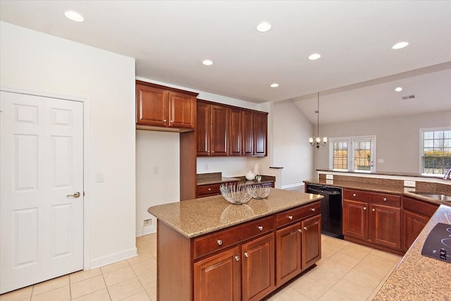 kitchen with decorative light fixtures, black dishwasher, sink, a center island, and light tile patterned floors