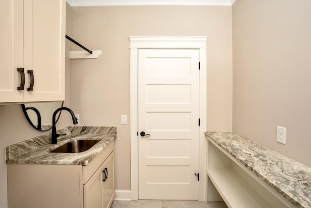 laundry room featuring washer hookup and sink