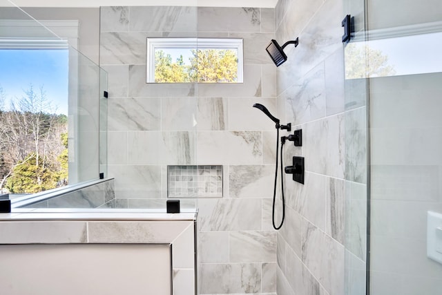 bathroom with a tile shower