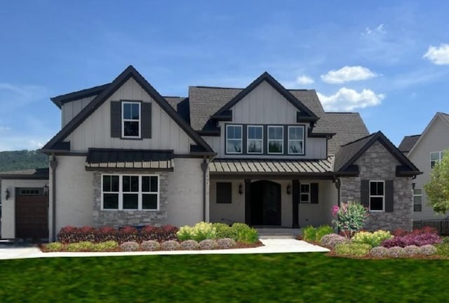 view of front of house featuring a garage and a front lawn