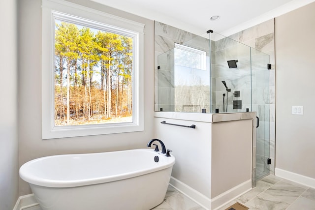 bathroom with independent shower and bath and a healthy amount of sunlight