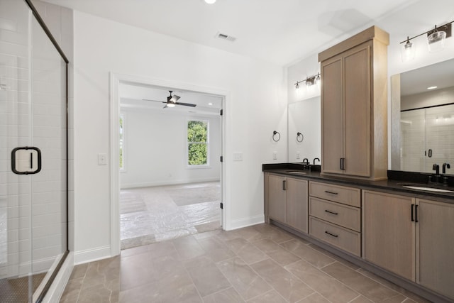 bathroom featuring vanity, a shower with door, and ceiling fan