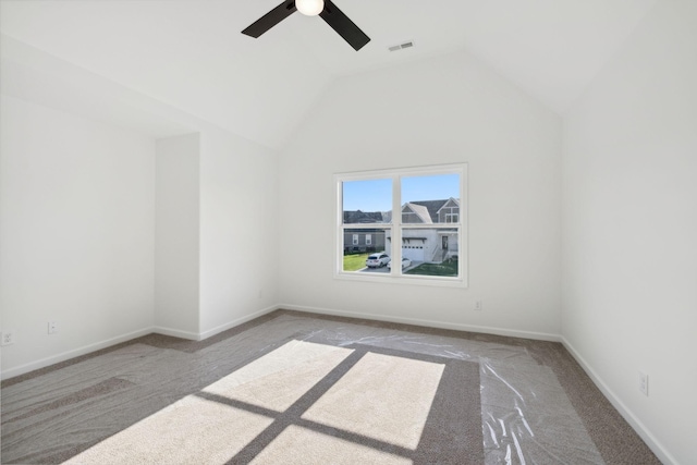 empty room featuring ceiling fan and lofted ceiling