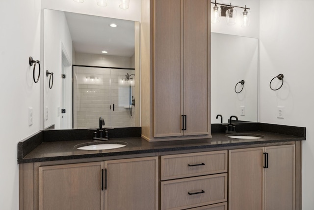 bathroom with vanity and a shower with shower door