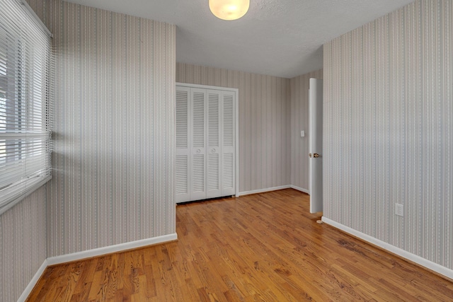 unfurnished room with light hardwood / wood-style floors