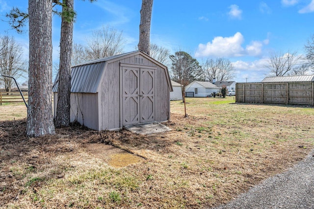 view of outbuilding featuring a yard