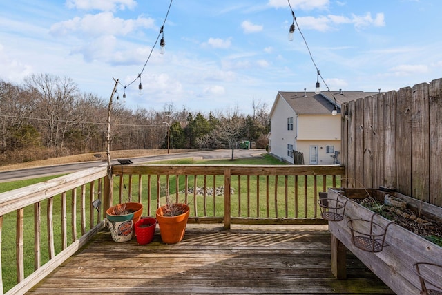 wooden terrace with a yard