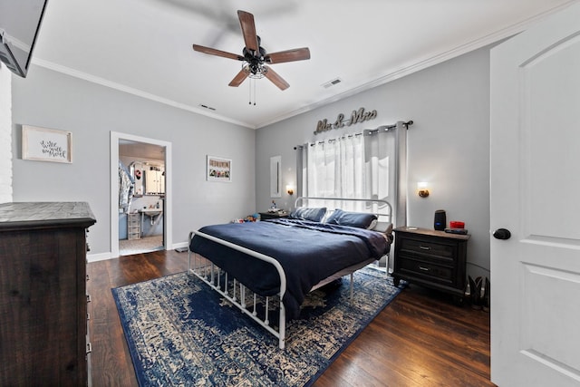 bedroom with hardwood / wood-style flooring, visible vents, and crown molding