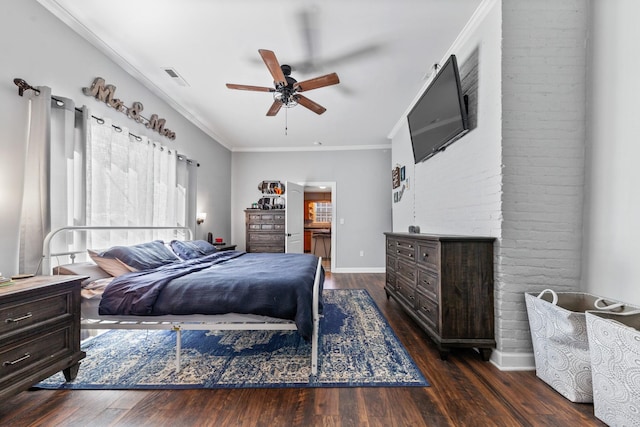 bedroom featuring ceiling fan, dark wood-style flooring, visible vents, baseboards, and crown molding