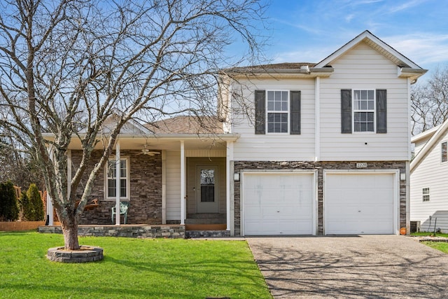 view of front of home featuring a garage, stone siding, aphalt driveway, and a front yard