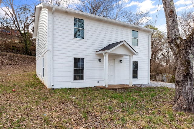 front facade with a front yard