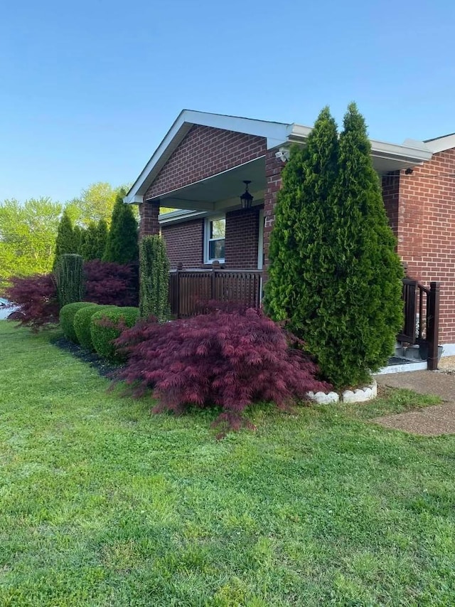 view of property exterior featuring a yard