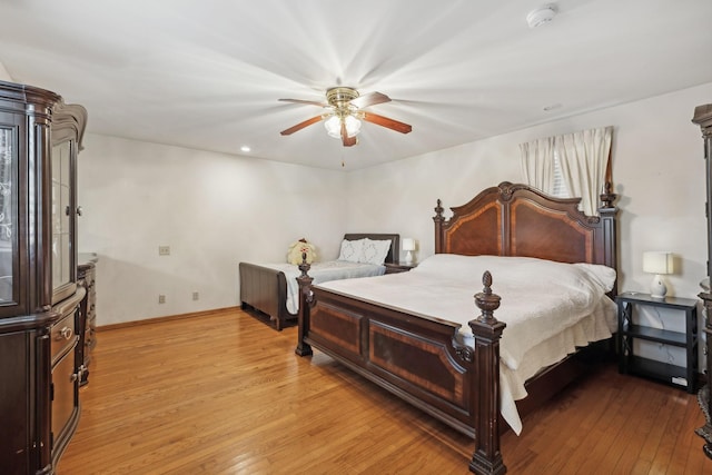 bedroom featuring ceiling fan and light hardwood / wood-style flooring