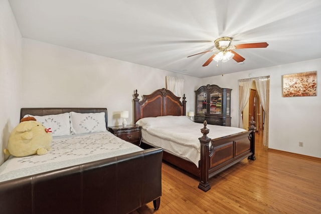 bedroom featuring ceiling fan and light wood-type flooring