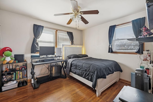 bedroom featuring ceiling fan and dark hardwood / wood-style floors