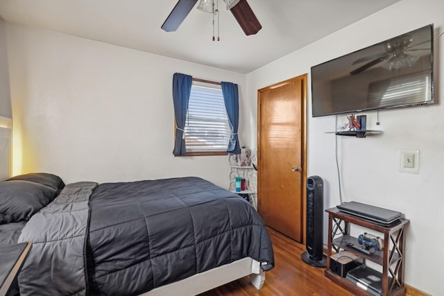 bedroom with wood-type flooring and ceiling fan